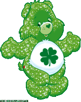 a green care bear with a four leaf clover on his belly