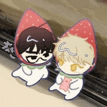 two cartoon characters wearing strawberries on their heads are sitting next to each other on a table .