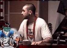 a man wearing a shirt that says ' nc hip hop ' on it