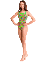 a girl in a neon green swimsuit with flamingos on it stands with her hands on her hips