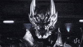 a black and white photo of a knight with horns and armor