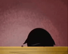 a black cartoon character with white eyes and a red tongue sticking out