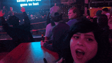 a woman sitting at a table with the word don 't on the top