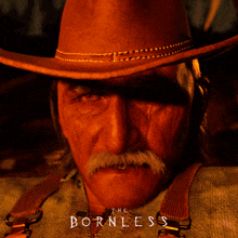 a close up of a man 's face with the words " the bornless " below him