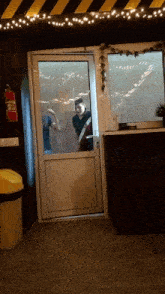 a fire extinguisher is hanging on the wall above a door