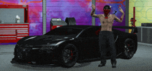 a man in a red bandana stands in front of a black car with the word ferrari on it