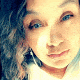 a close up of a woman 's face with her eyes closed