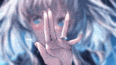 a girl with a ring on her finger covering her face