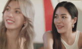 two women are sitting next to each other smiling and the caption says lingormgifs