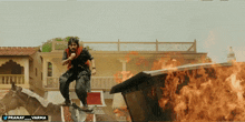 a man is jumping over a burning building with the hashtag pranay_varma on the bottom