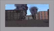 a cartoon drawing of a city with smoke coming out of a building .