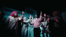 a group of people are dancing and one of them is wearing a jacket that says valentines