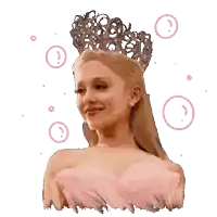 a woman in a pink dress and a crown on her head
