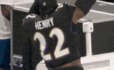 a football player with the name henry on the back of his shirt