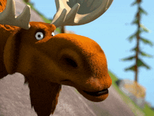a close up of a moose 's head with antlers and a tree in the background