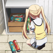 a girl is looking at a box of pringles