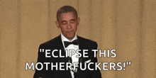 obama is holding a microphone in his hand and saying `` eclipse this motherfuckers '' .