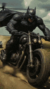 a man in a batman suit is riding a motorcycle