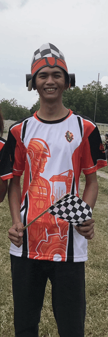 a man wearing a red and white shirt with a robot on it