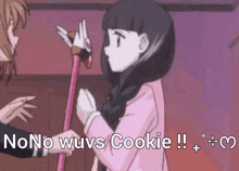 a girl is holding a cane with the words " no no wuvs cookie " written on it