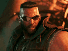 a man with a beard wearing sunglasses and a vest is standing in front of a fire .