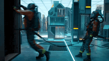two people in a room with a sign that says hbo max in the background