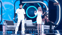 a group of people standing on a stage with one 31 written on the bottom