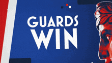 a poster that says " guards win " with a statue in the background