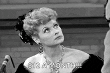 a woman is wearing a necklace and earrings and says `` $ 12 a month '' .