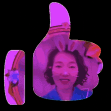 a woman wearing bunny ears is giving a thumbs up sign