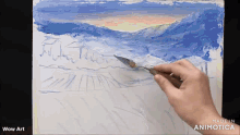 a person is painting a landscape on a canvas with the words wow art below it