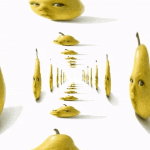 a bunch of pears with faces on them on a white background