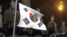 a korean flag with a cat on it is being waved by a group of people