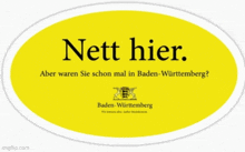 a yellow sign that says nett hier in black letters