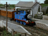 a blue train with the number 1 on the side