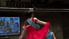 a woman in a wrestling ring with a belt that says ayame
