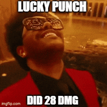 a man wearing sunglasses and a red suit says lucky punch