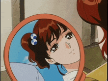 a girl is looking at herself in a mirror and crying