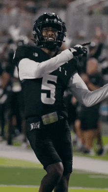 a football player wearing a number 5 jersey