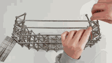 a person is playing with a set of metal balls