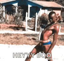 a man in a bikini says heyy boo in front of a house ..