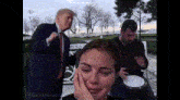a man in a suit and tie is standing next to a woman crying