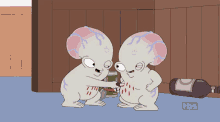 two cartoon characters standing next to each other with a tbs logo behind them