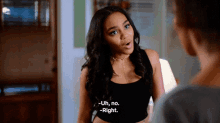 a woman in a black tank top is talking to another woman and says " uh no right "