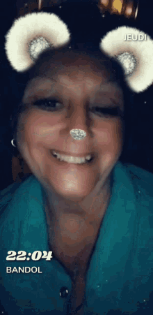 a woman wearing a snapchat filter that says bandol on it