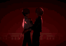 a couple of anime characters standing next to each other in front of a red background
