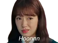 a close up of a woman 's face with the word hoonnn on the bottom right