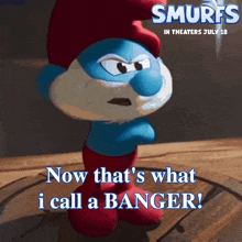 a poster for smurfs in theaters july 18