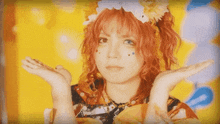 a woman with red hair and flowers on her head holds her hands out