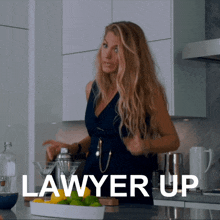 a woman in a kitchen with the words " lawyer up " written on it